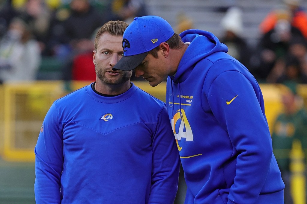 Sean McVay speaking with Kevin O'Connell on the sideline with the Los Angeles Rams