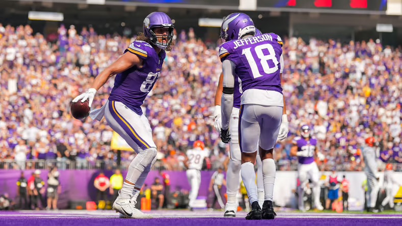Justin Jefferson and T.J. Hockenson celebrating after scoring a touchdown