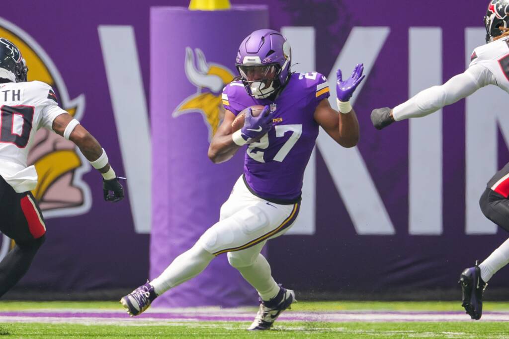 Jordan Mason running the football as a member of the Minnesota Vikings