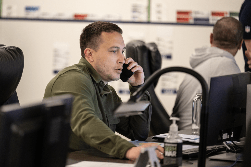 Nolan Teasley on the phone as Assistant General Manager of the Seattle Seahawks