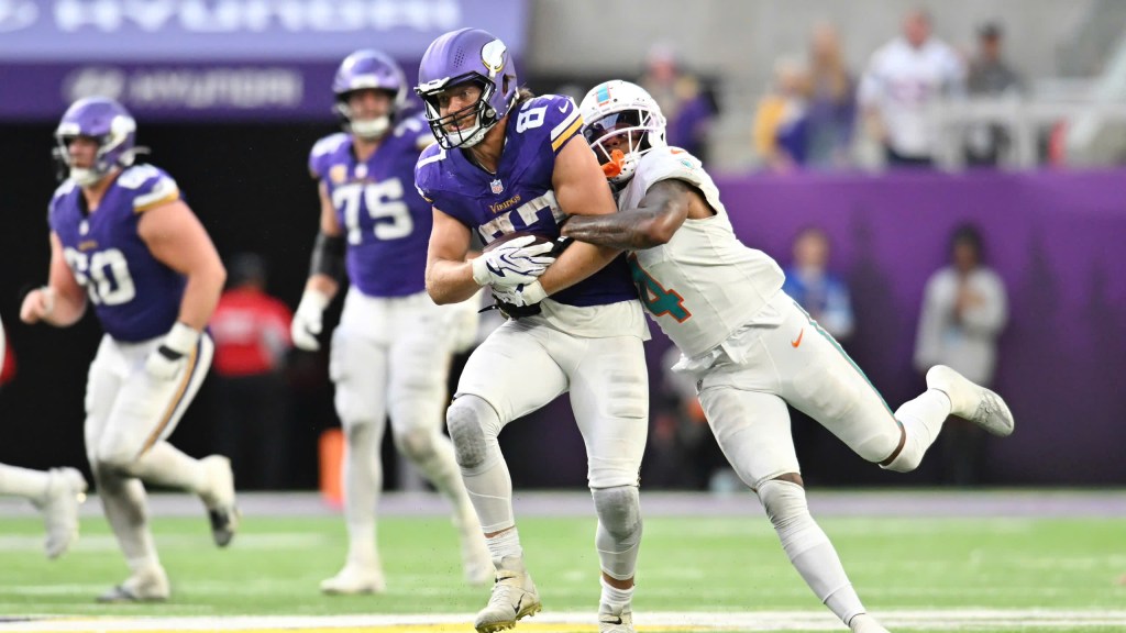 T.J. Hockeson catching a pass and getting tackled against the Miami Dolphins in week 4.